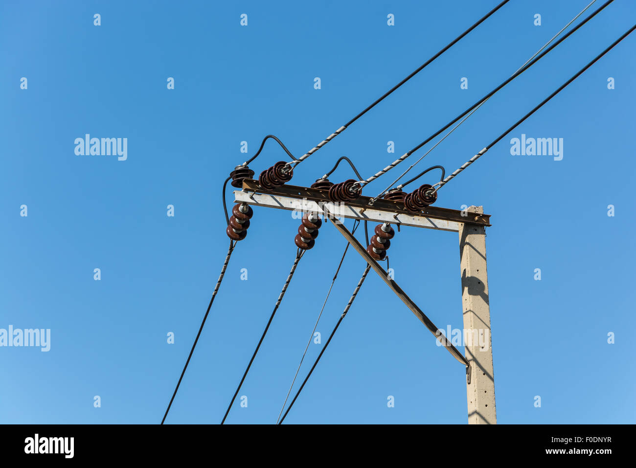 Wire on pole and blue sky background Stock Photo - Alamy