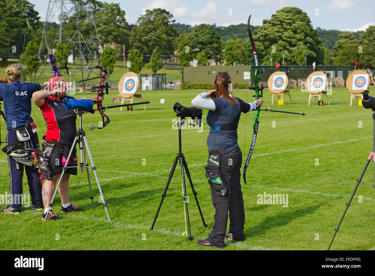 Woman archers shooting compound or recurve bows in archery competition, Rowdon Meadows, Bradford, West Yorkshire. N.C.A.S. World Stock Photo