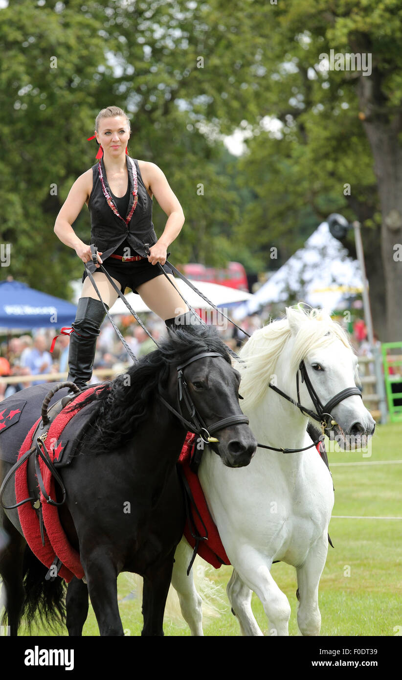 Glamorous Female equestrian display team, Jive Pony, completing a stunt at a national event held in 2015 Stock Photo