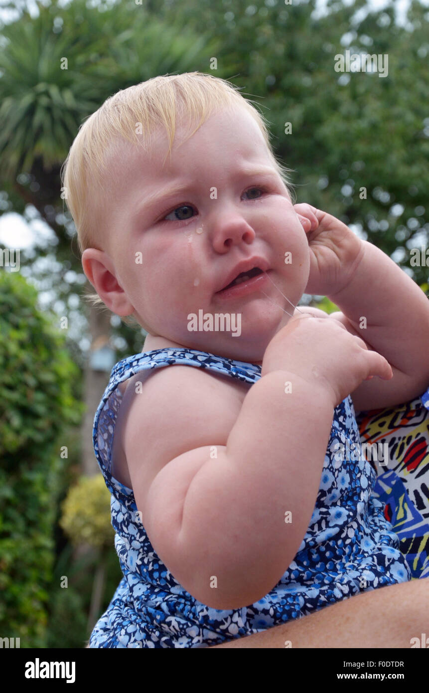 Baby crying store in pain
