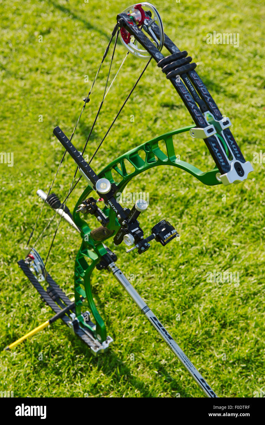 Modern compound archery bow showing eccentric pulleys for levering, the riser and limbs, the sight and stabilizers Stock Photo