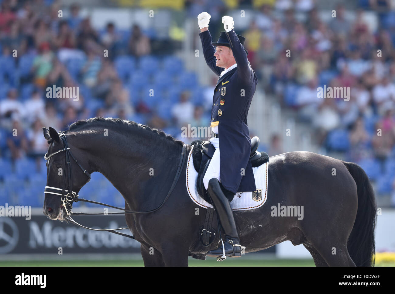 matthias-alexander-rath-of-germany-reacts-on-his-horse-totilas-after