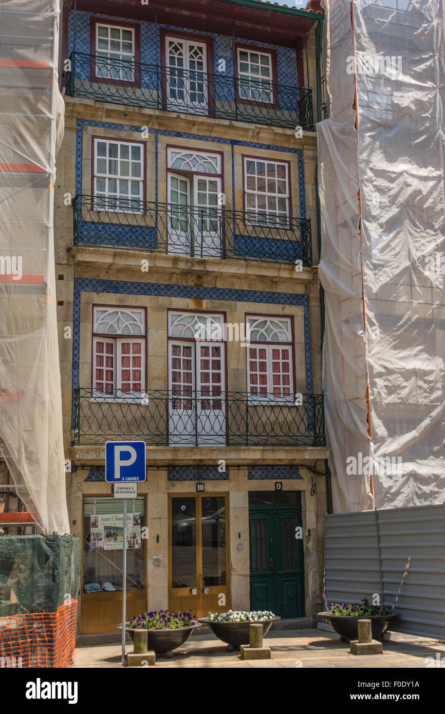 four story terraced house/shop with blue tiles in Rua Grão Vasco square at the back of the Cathedral, Viseu, Portugal Stock Photo