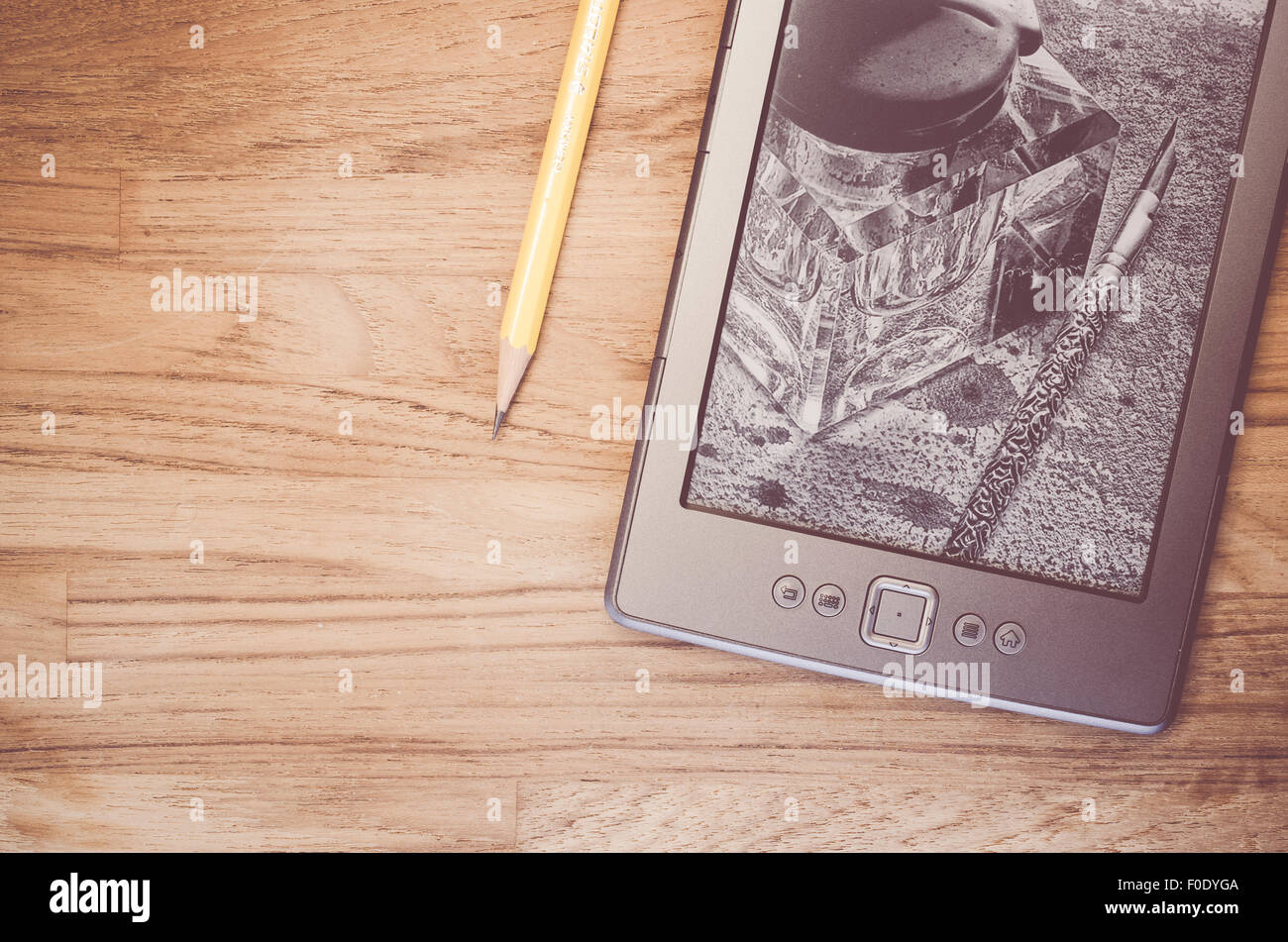 electronic reading device on a natural wood background ebook reader