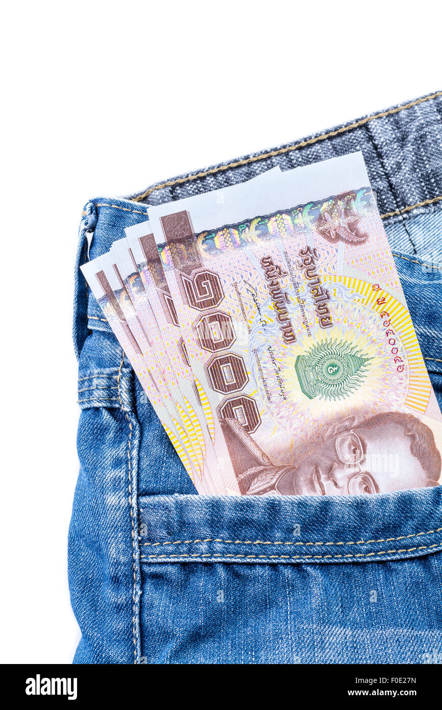 Thai Money 1000 Bath on blue jeans isolated on white background Stock Photo