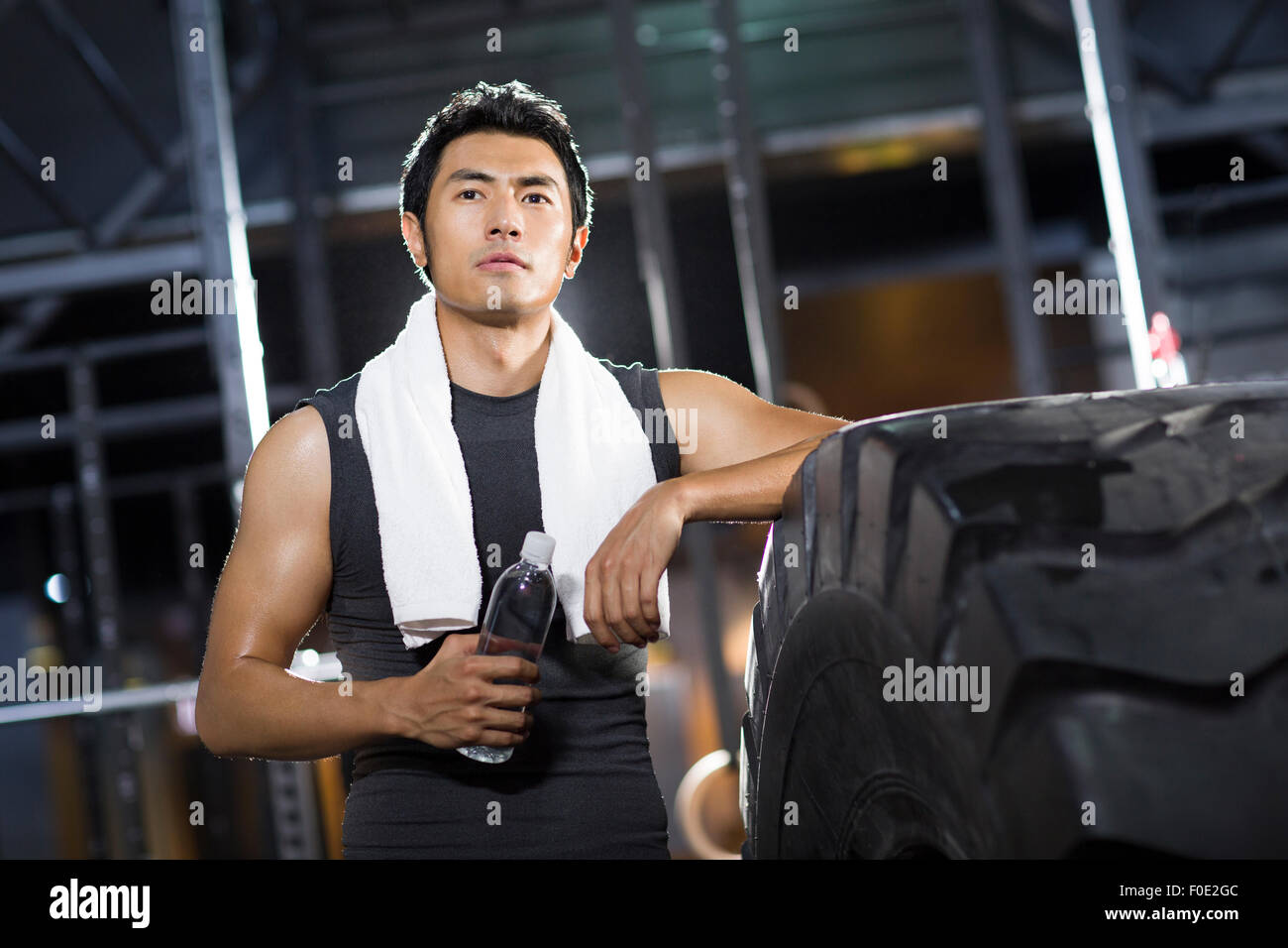 Young man resting at gym Stock Photo - Alamy