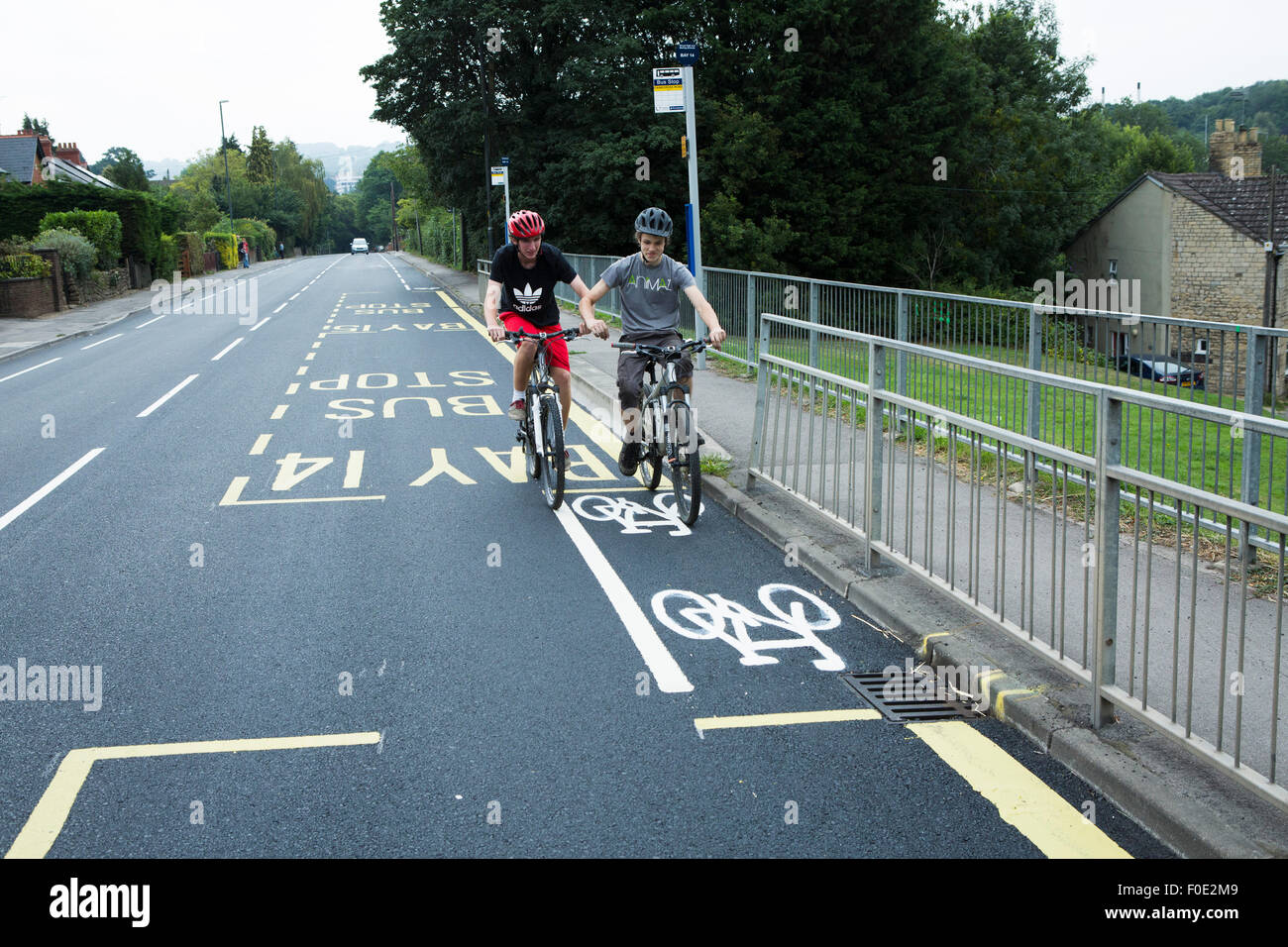 Stroud, UK. 11th Aug, 2015. Britain's shortest cycle lane is painted on a newly tarmacced road between two school bus stops. The lane is opposite a local school to where children and teenagers rides their bikes. Stroud. Gloucestershire. United Kingdom. Credit:  Alexander Caminada/Alamy Live News Stock Photo