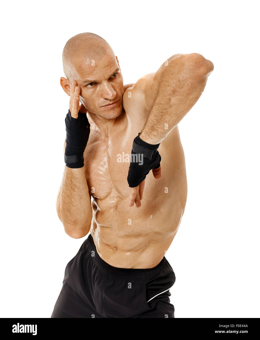 Muay thai fighter delivering an elbow hit isolated on white background