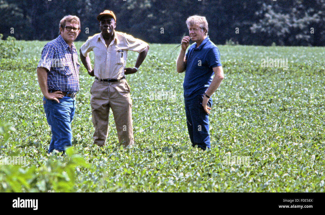 President Jimmy Carter and his brother Billy Carter are joined by a tenant farmer as they assess their summer peanut crop. 11th Nov, 2014. The Carters own tracts of farmland around Plains, Georgia along with a peanut warehouse in that city, although the President's holdings are held in a blind trust during his presidency. © Ken Hawkins/ZUMA Wire/Alamy Live News Stock Photo