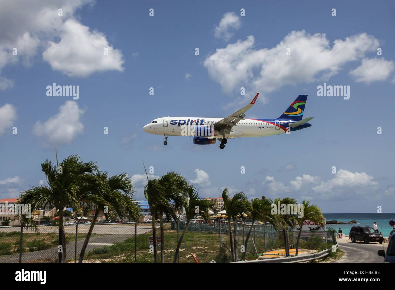 Airplane Airbus A320 Spirit is landing on Princess Juliana International  Airport over Maho Bye Beach, St.Marten, Stock Photo