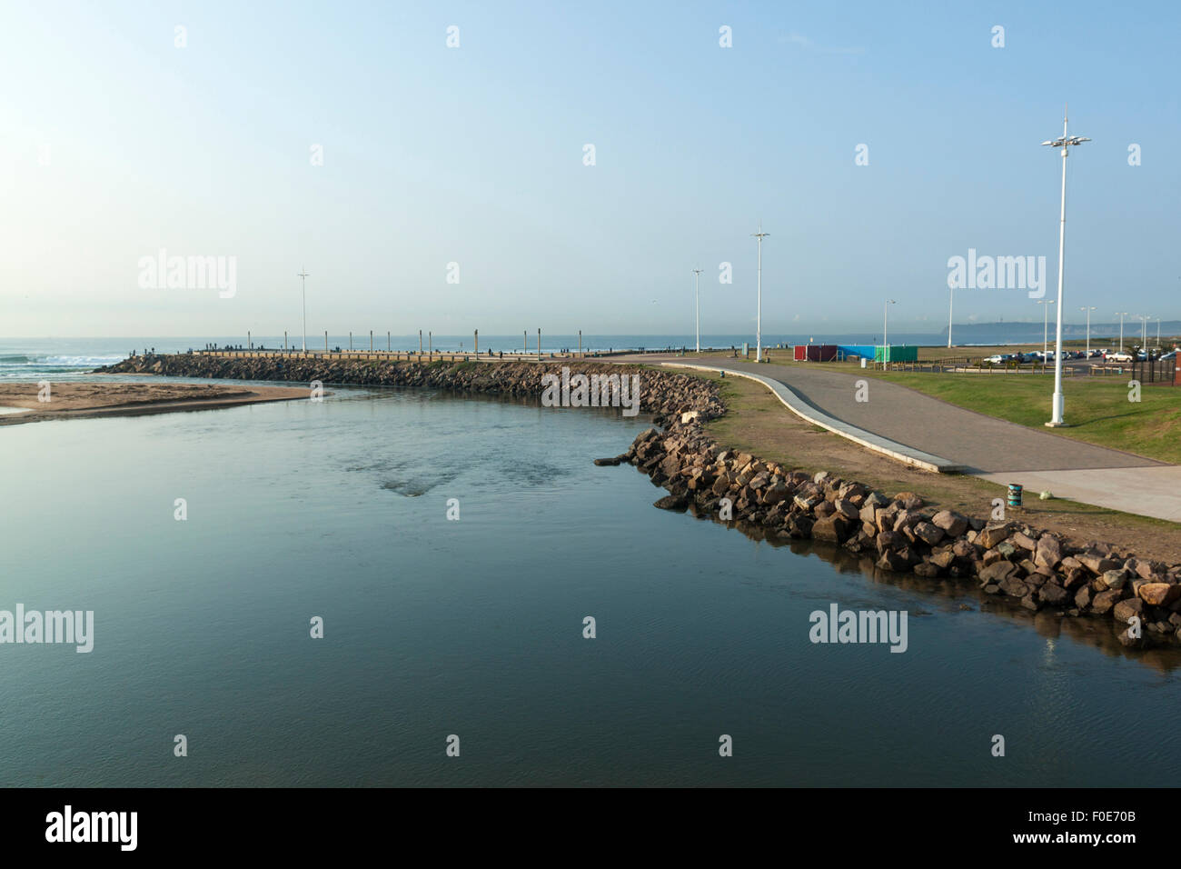 View of Blue Lagoon pier at Umgeni river mouth lined by walkway in