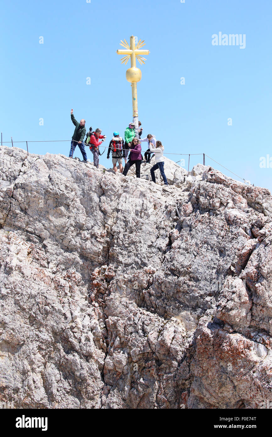 Tourists/climbers at the summit of Zugspitze, Germany´s tallest mountain peak located in southernmost Bavaria Stock Photo