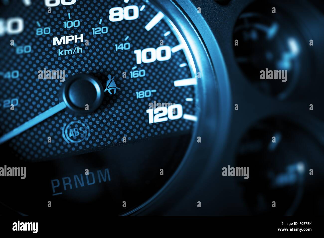 Driving Speed Control. Car Tachometer Closeup. Dark Blue Color Grading