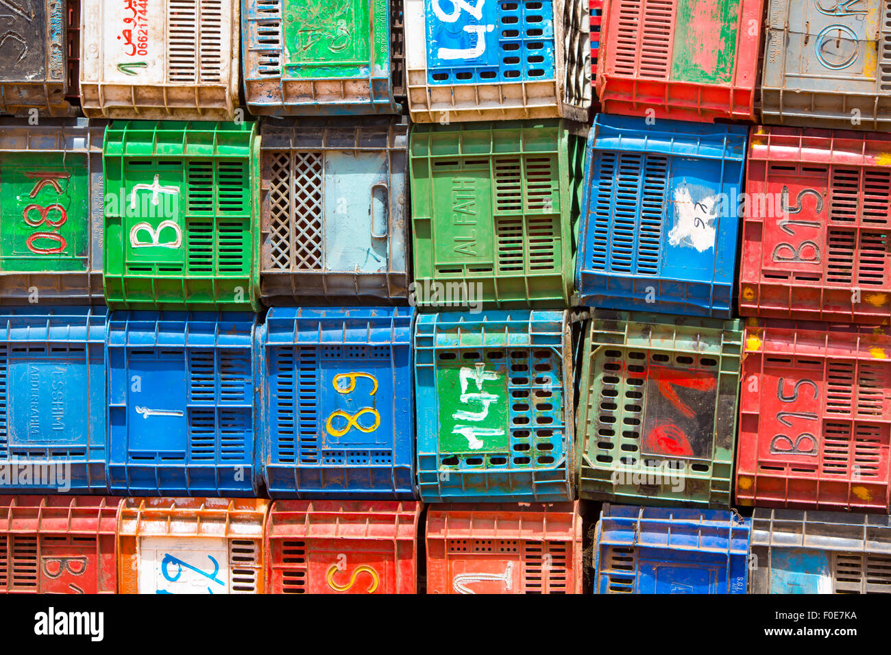 Colorful boxes plastic crates. Packing containers piles for fish storage of catch. Morocco Stock Photo