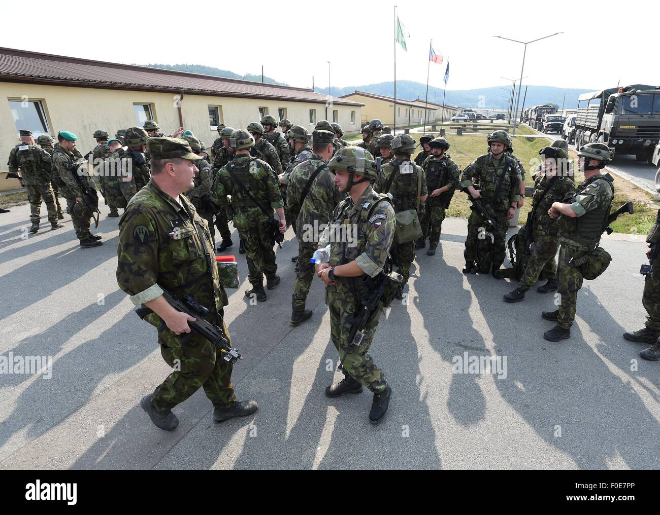 Hohenfels, Germany. 13th Aug, 2015. Soldiers from eight countries - of the USA, the Czech Republic, Britain, Germany, Canada, Georgia, Hungary and Serbia - participate the military NATO exercise Allied Spirit in Joint Multinational Readiness Center (JMRC) near Hohenfels in Germany, on August 13th, 2015. Czech Colonel Josef Kopecky, commander of the 7th mechanised brigade and also commander of the 7th BUU, is the commander of the whole international brigade task force with over 4500 soldiers. Pictured soldiers leaving to the tactical field position. © Ludek Perina/CTK Photo/Alamy Live News Stock Photo