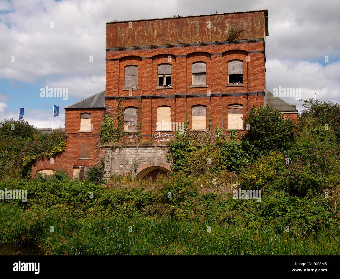Old derelict commercial building beside the Bridgwater and Taunton Canal, Taunton, Somerset, UK