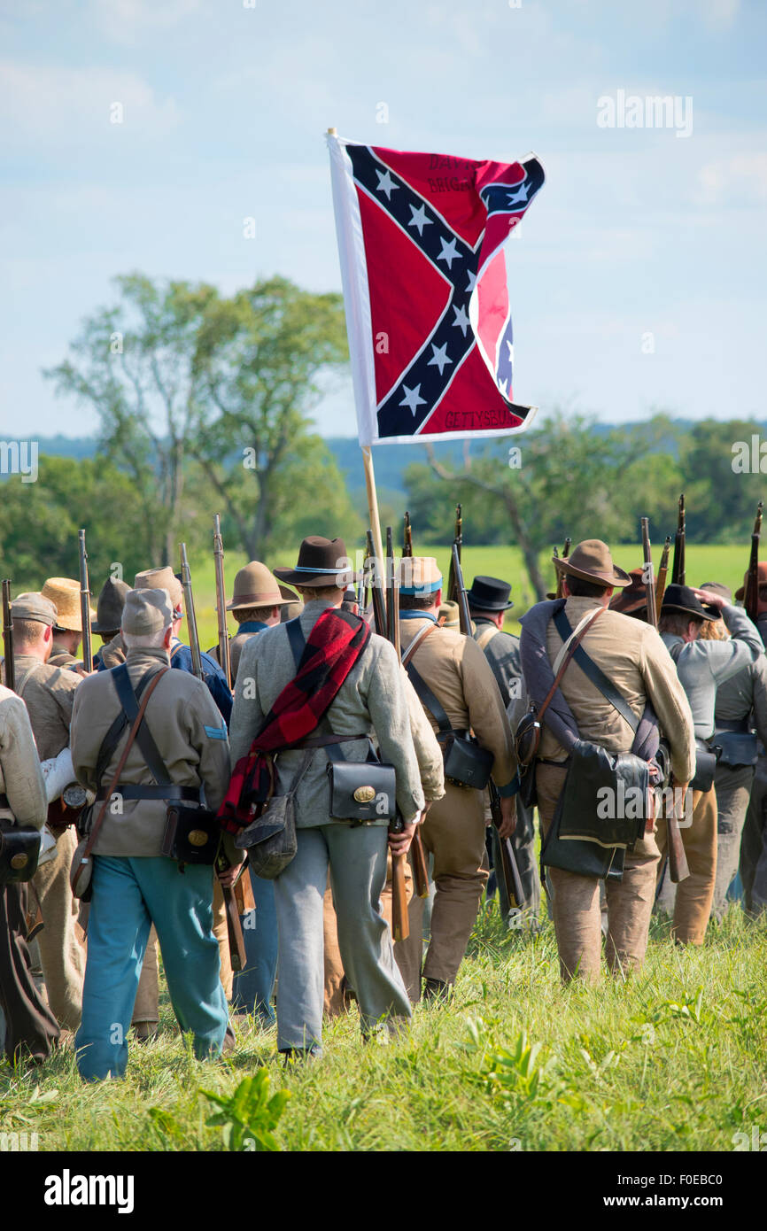 Gettysburg reenactment confederate army soldiers marching with confederate flag Stock Photo