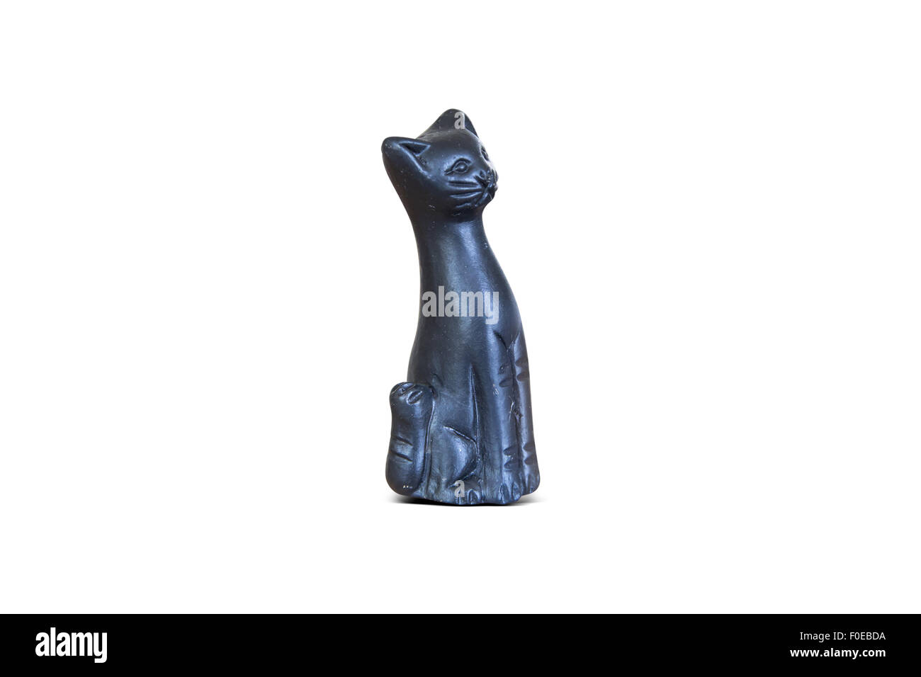 Close up front view of black porcelain cat trinket, isolated on white