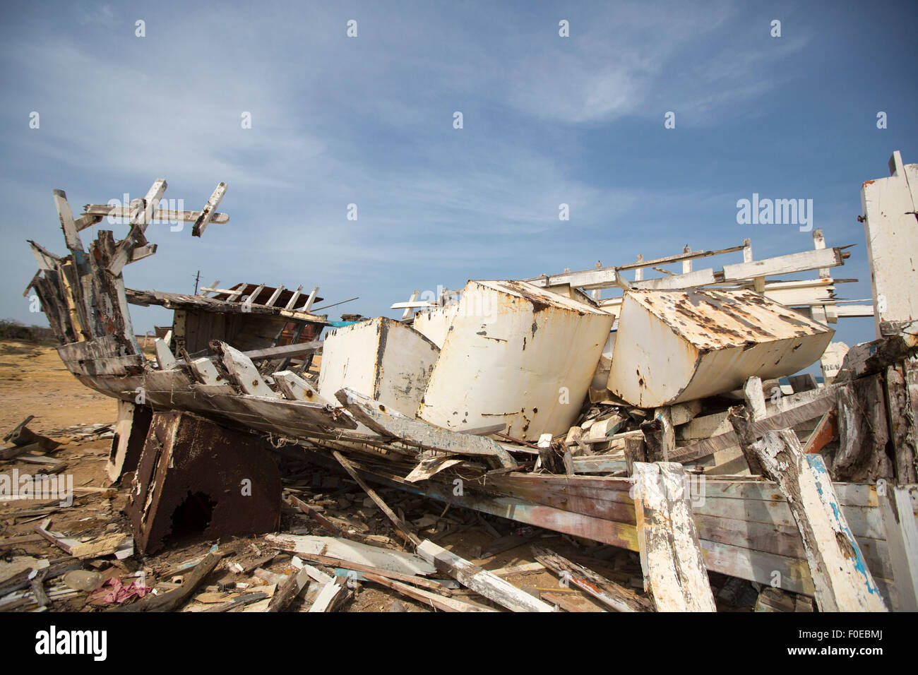 Old shipwreck disemboweled standing on the beach against a blue sky. Margarita Island. Venezuela Stock Photo