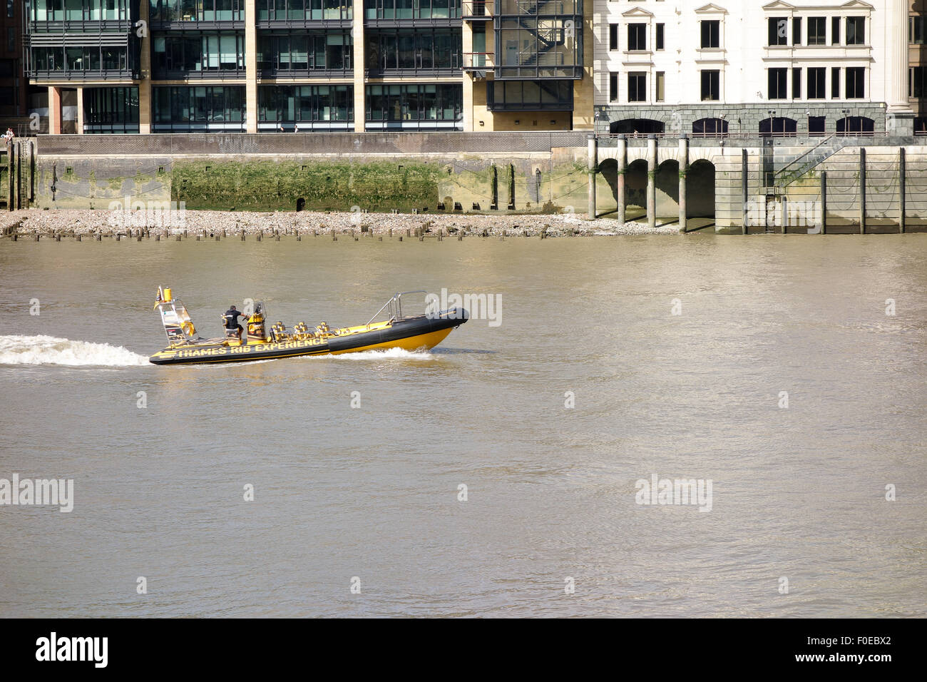 A speed boat travels along the River Thames in London. Stock Photo