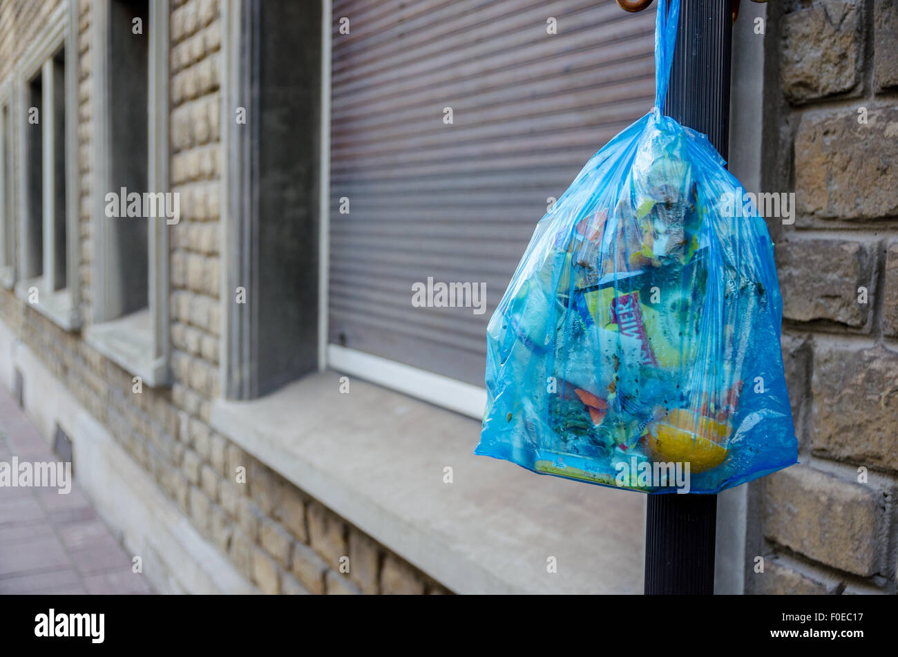 Blue garbage bag hanging in the streets of Boulogne sur Mer, Pas de Calais, France Stock Photo