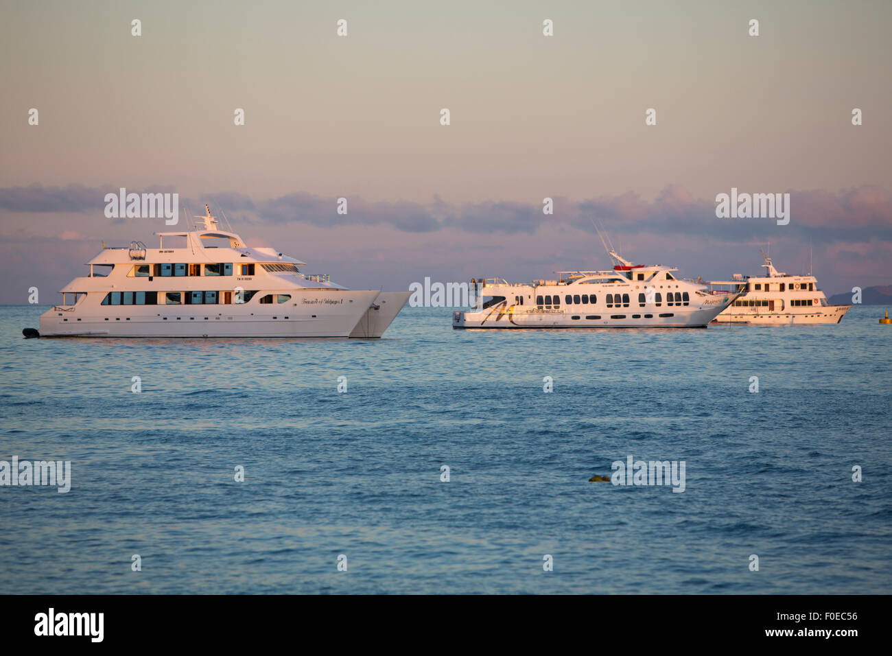 Sunset and cruise ships in the port of Puerto Ayora. Galapagos Islands, Ecuador on February 15, 2015 Stock Photo