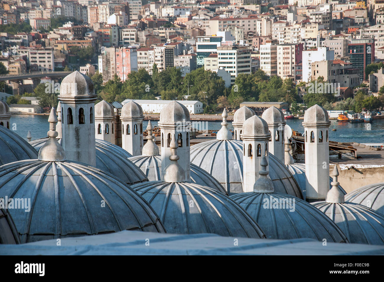 View across the domes of the shopping arcade from the Suleymaniye Mosque towards the city of Istanbul Stock Photo