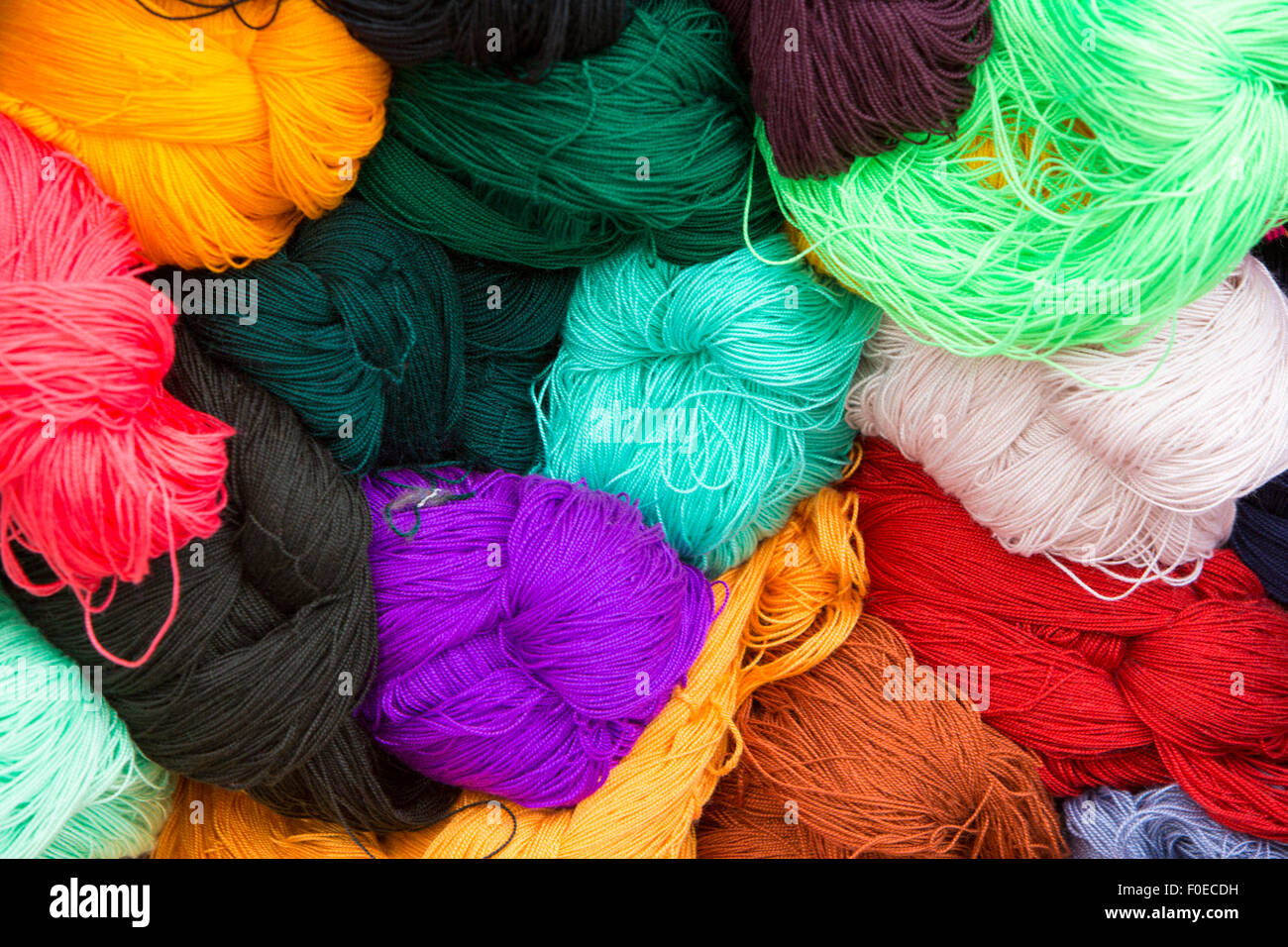 Top view of colorful balls of wool at the Andean craft market of Otavalo, Ecuador 2015 Stock Photo