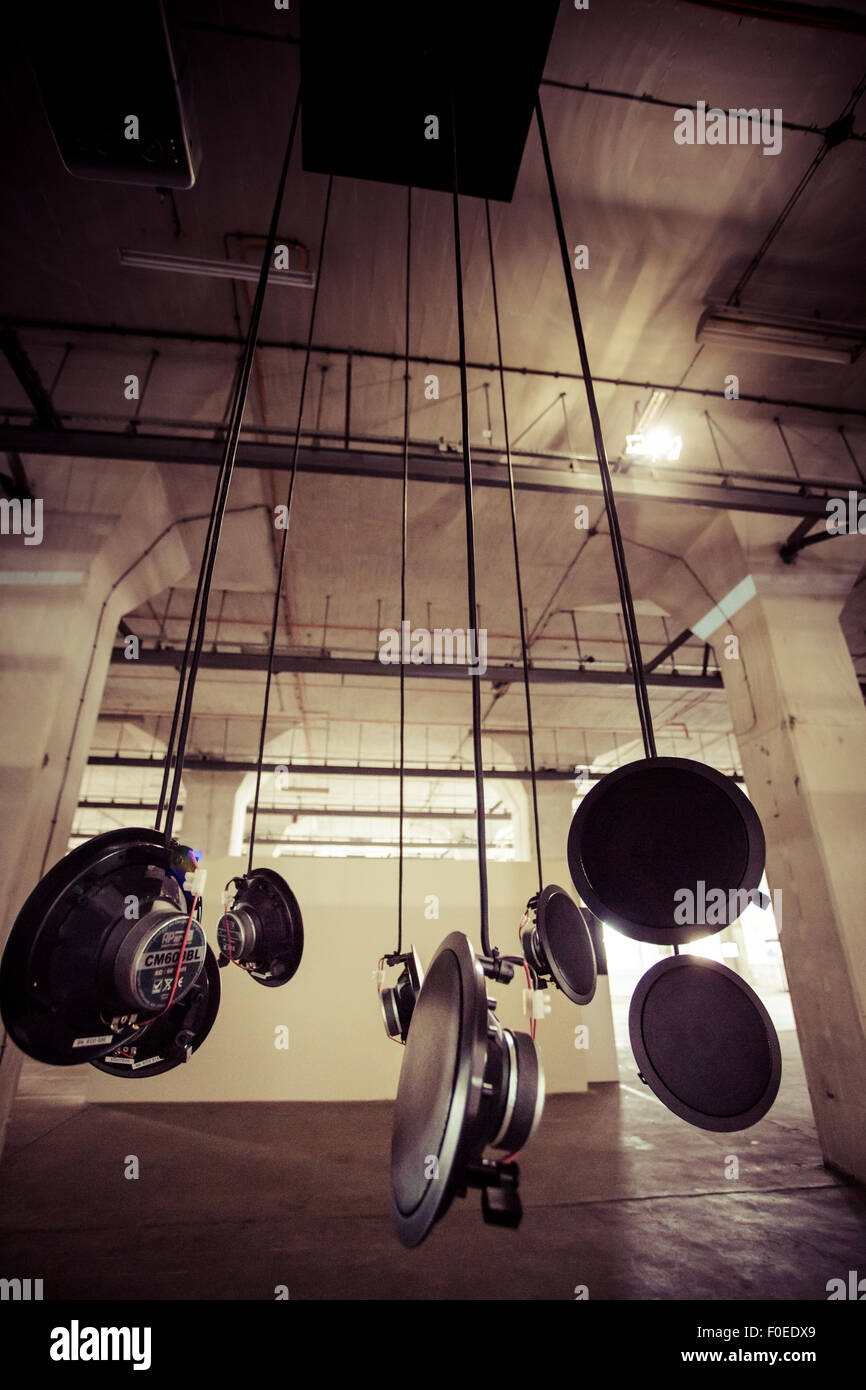 Detail of hanging speakers. Art installation in an industrial site in Gdansk on September 18, 2013. Poland. Stock Photo