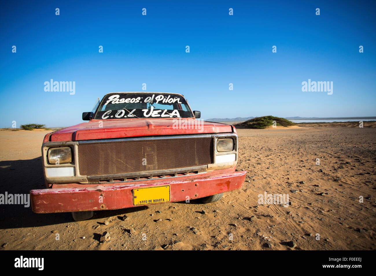 Car wreck on the beach of El Cabo De La Vela, La Guajira, Colombia 2014. Stock Photo