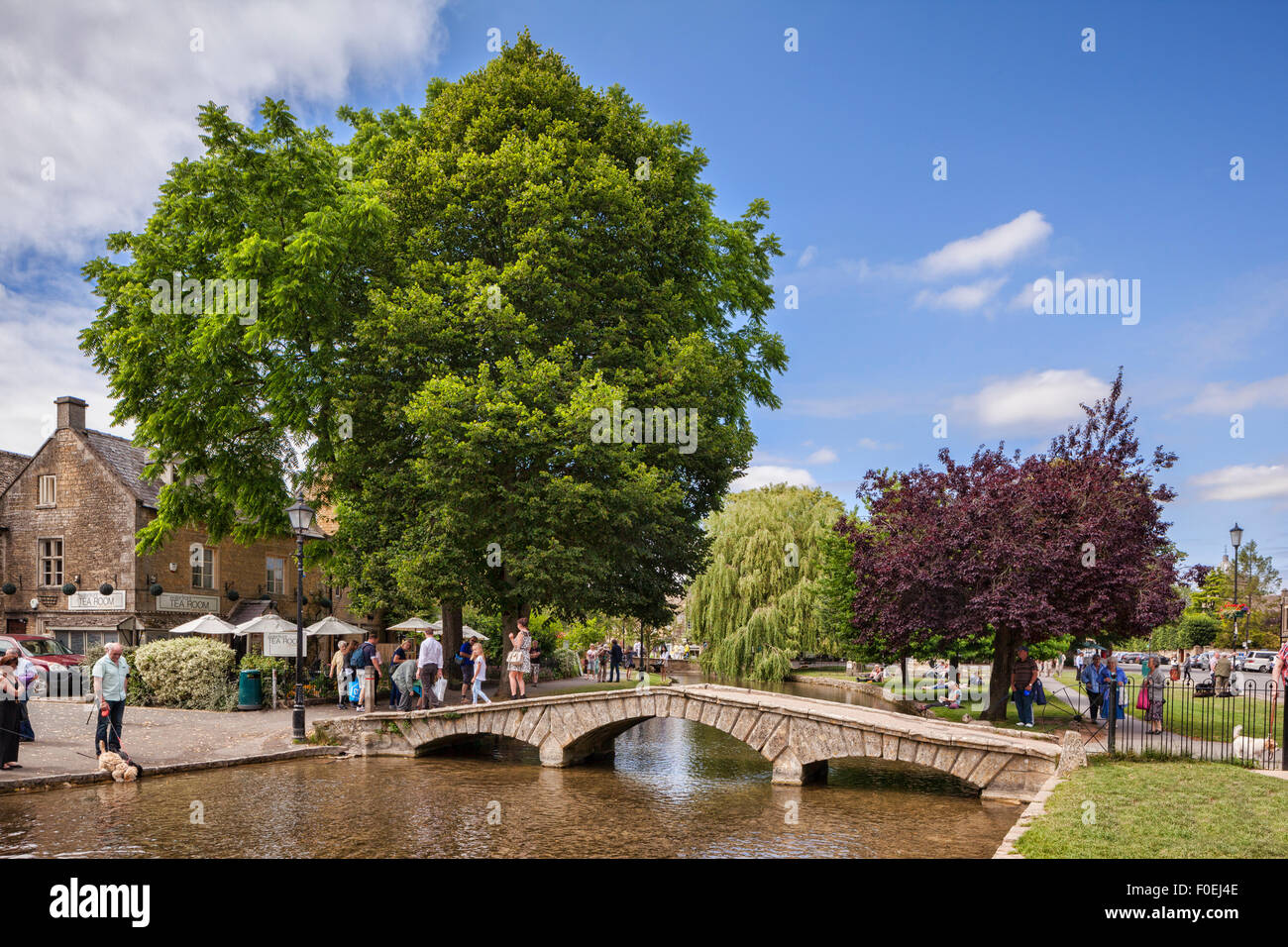 A summer afternoon in the Cotswold village of Bourton-on-the-Water, Gloucestershire, England. Stock Photo