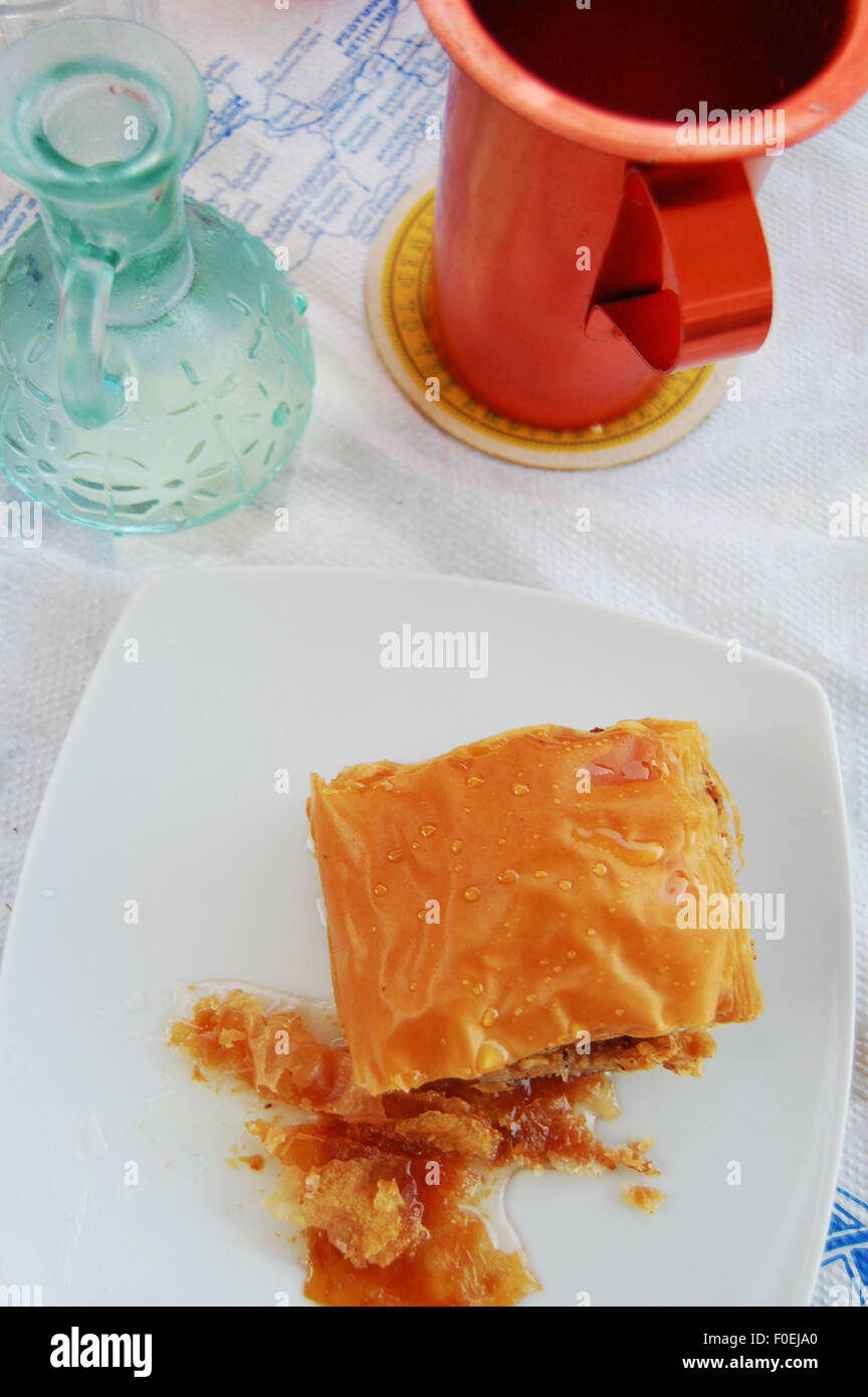 baklava and ouzo after dinner at a taverna in Loutro Crete Stock Photo