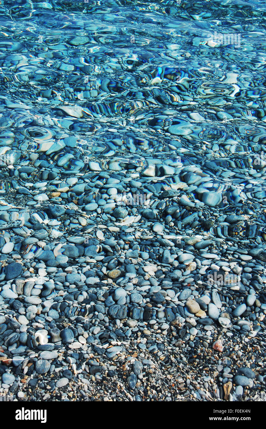 Clear water and pebbles at Sweetwater beach Crete Stock Photo - Alamy