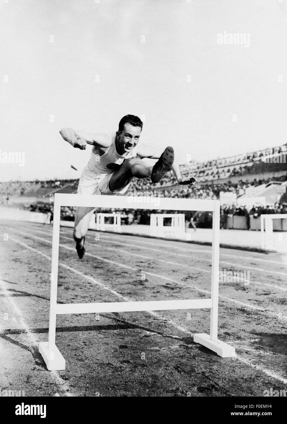 sports, athletics, running, runner jumping over hurdle, 1920, Additional-Rights-Clearences-Not Available Stock Photo