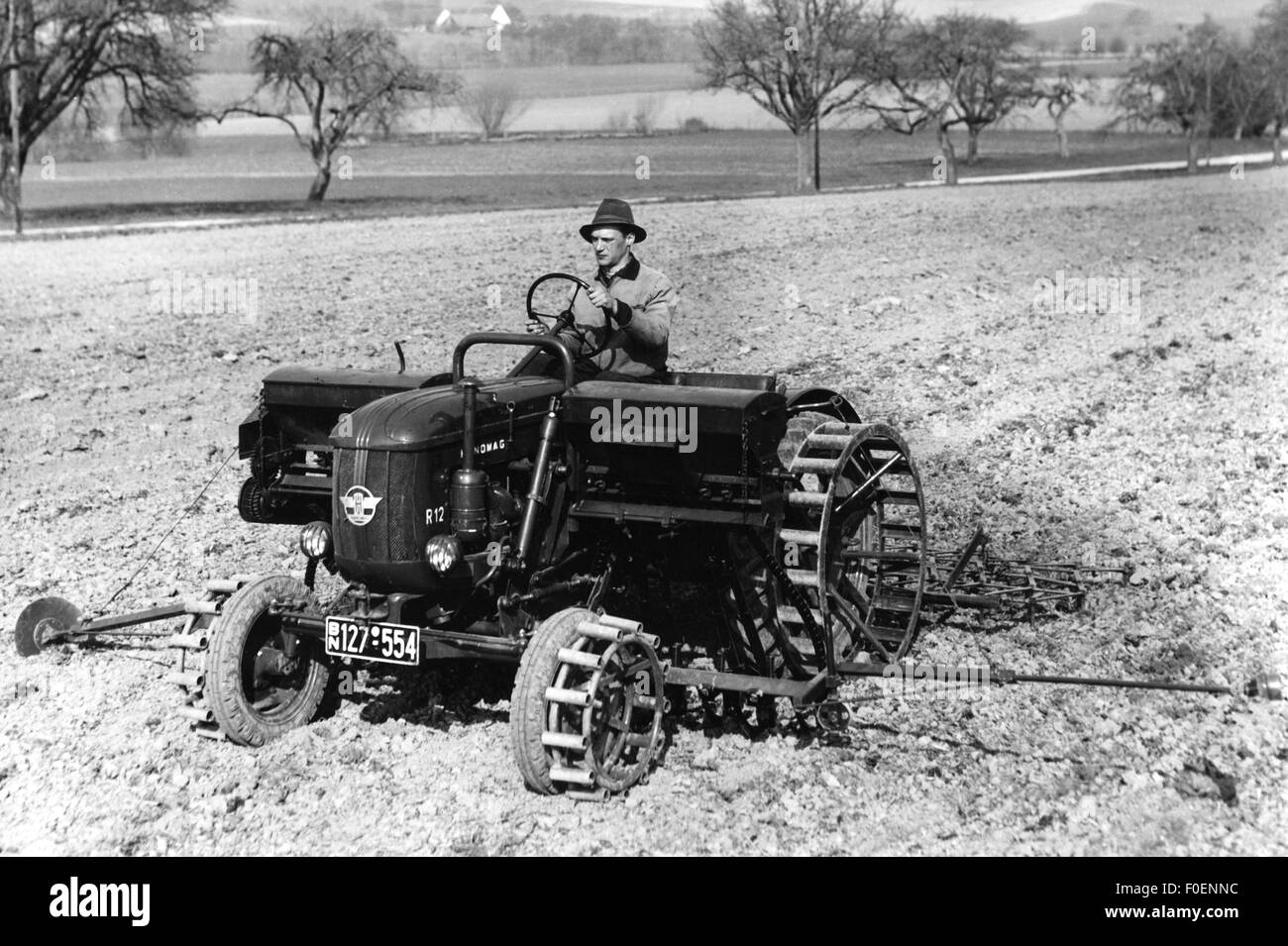 agriculture, machine, farmer with tractor Hanomag R12 on field, Lower Saxony, 1954 - 1958, Additional-Rights-Clearences-Not Available Stock Photo