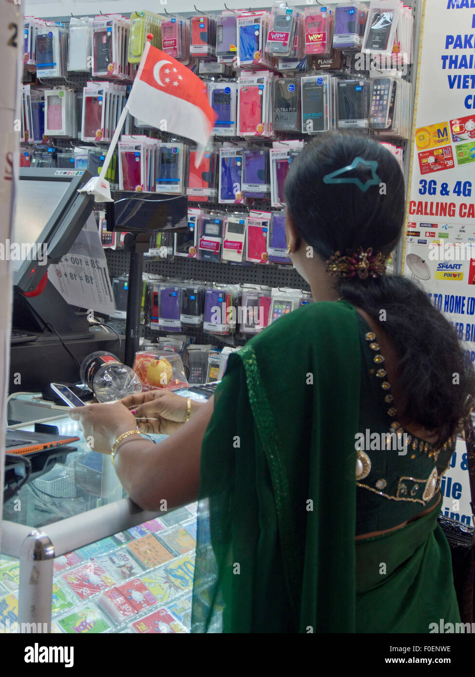 Indian woman at a mobile phone shop in the Tekka Centre shopping mall