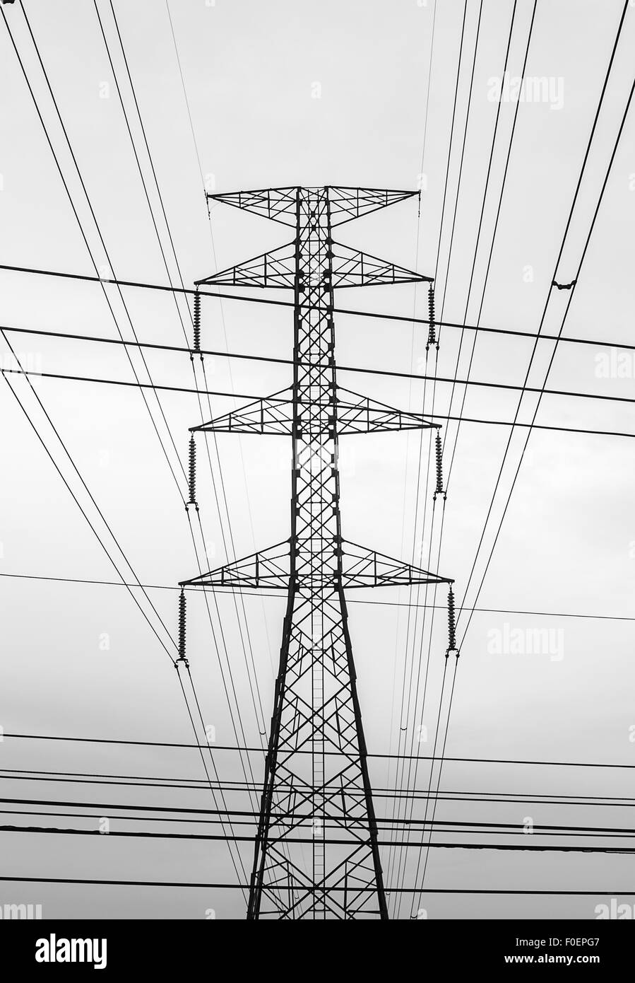 High voltage electricity pylon sky background Stock Photo - Alamy