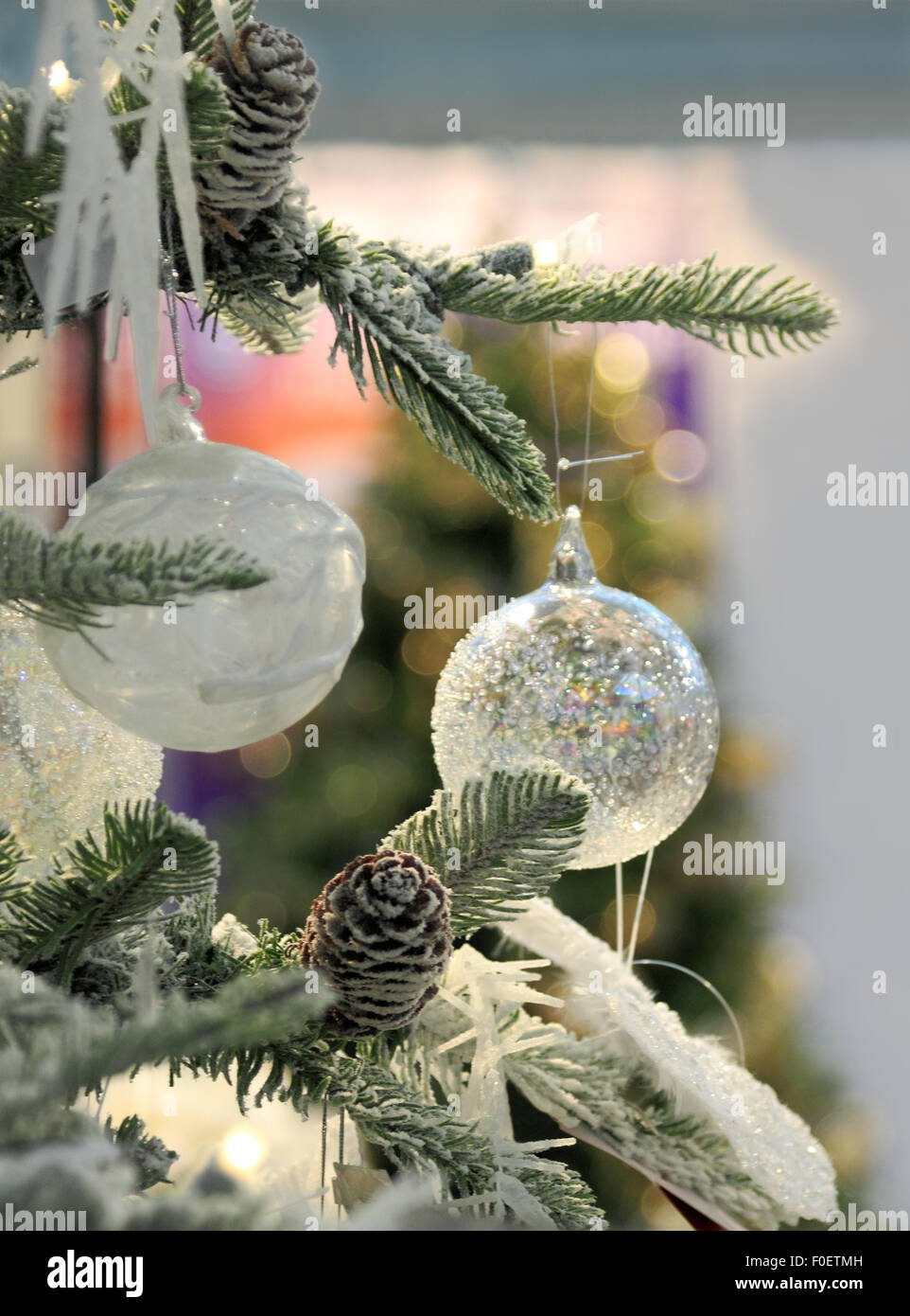 An artificial Christmas tree decorated with Christmas baubles. Stock Photo