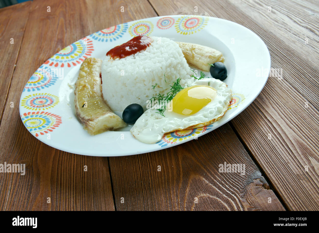 Arroz a la cubana con salsa de tomate - Cuban-style rice. originated in Peru Stock Photo