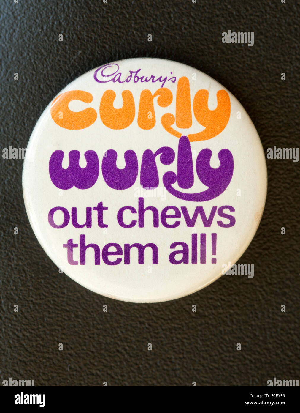 Vintage Pin Button Badge advertising Cadburys Curly Wurly Chocolate Bars Stock Photo
