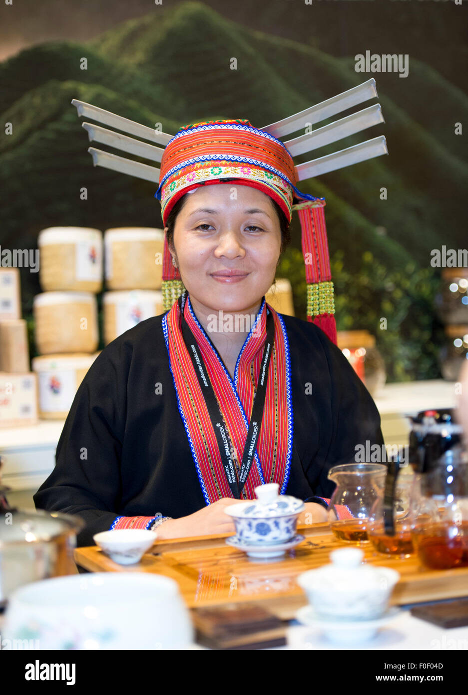 Hong Kong. 14th Aug, 2015. Chinese provincial lady serves tea. Guests ...