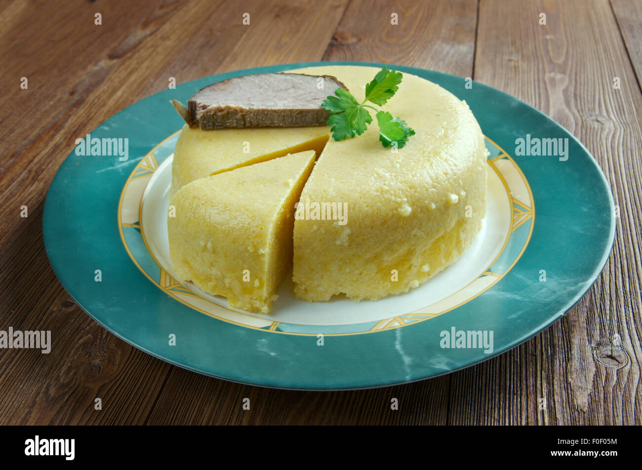 Mamaliga -  porridge made out of yellow maize flour, traditional in Romania, Moldova, and Western Ukraine. Stock Photo