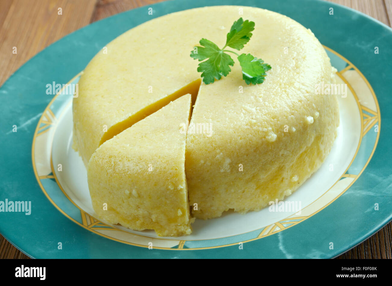 Mamaliga -  porridge made out of yellow maize flour, traditional in Romania, Moldova, and Western Ukraine. Stock Photo