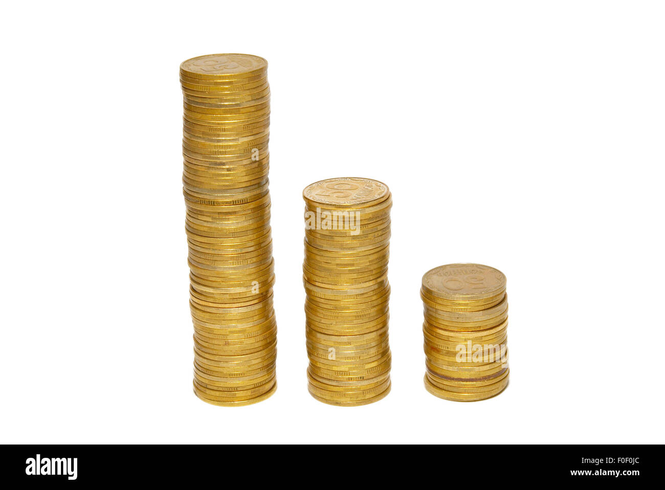 Stacks of golden coins isolated on white Stock Photo - Alamy