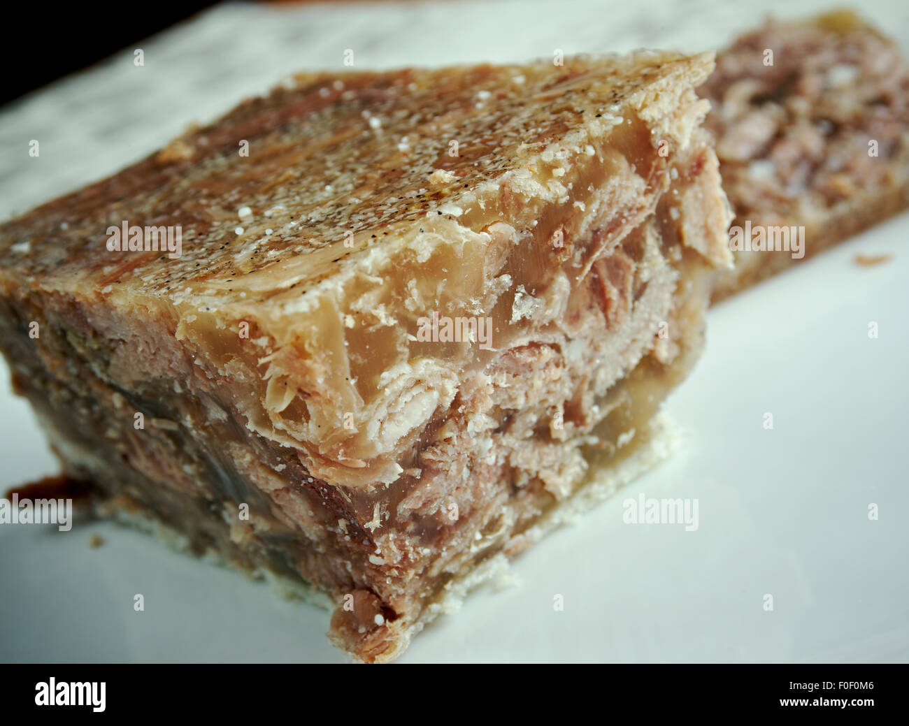 Jellied veal - cold cut dish made from veal, sometimes pork, stock, onion and spices such as allspice.traditional dish for Chris Stock Photo