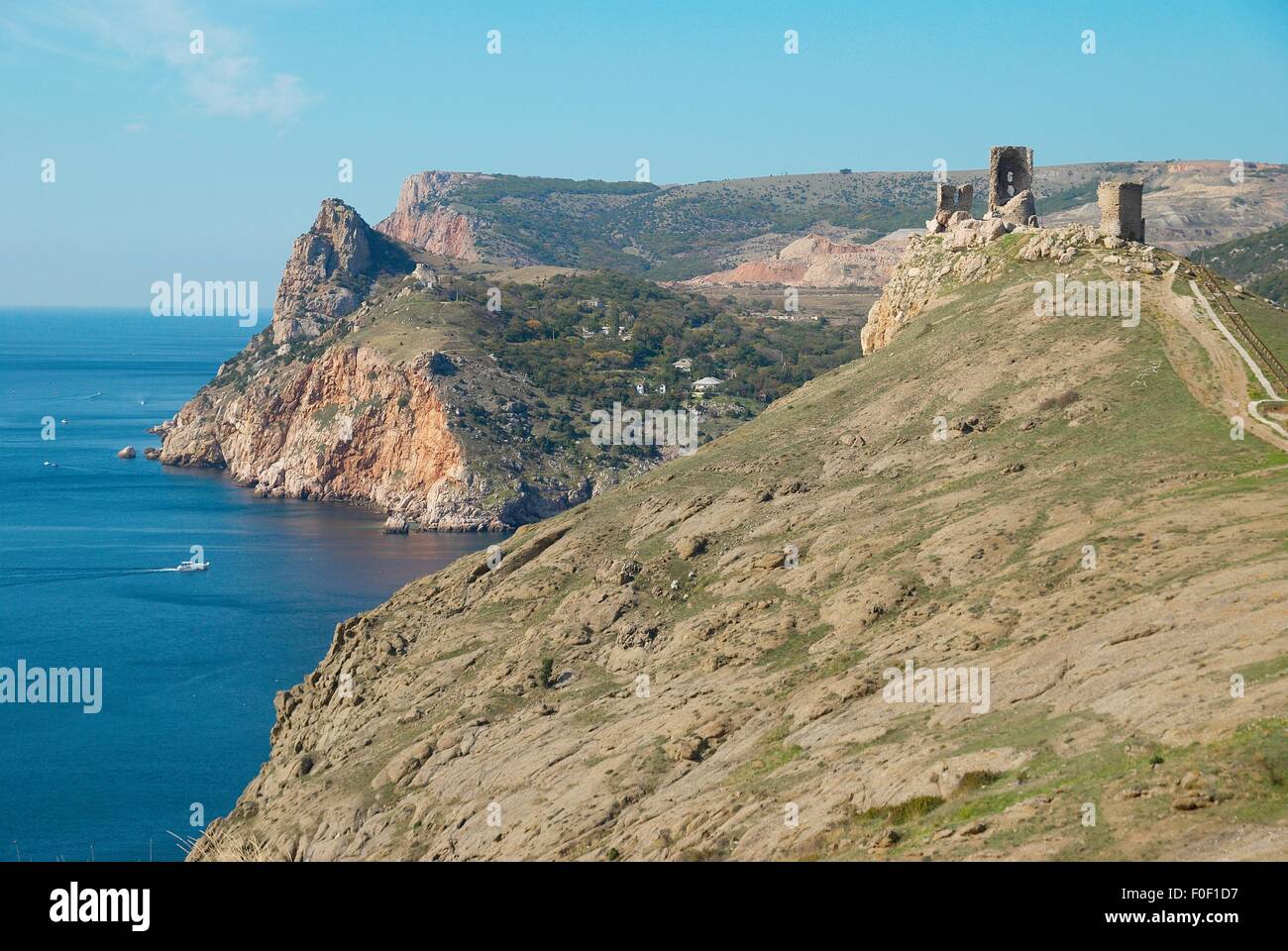 Sea landscape with rocks and tower Stock Photo - Alamy
