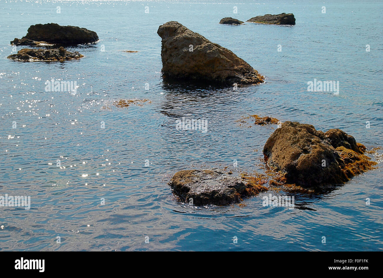 Sea landscape with rocks and water surface Stock Photo - Alamy