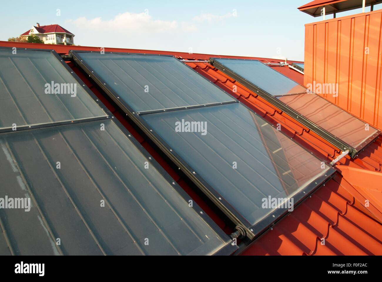 Alternative energy- solar system on the house roof Stock Photo - Alamy