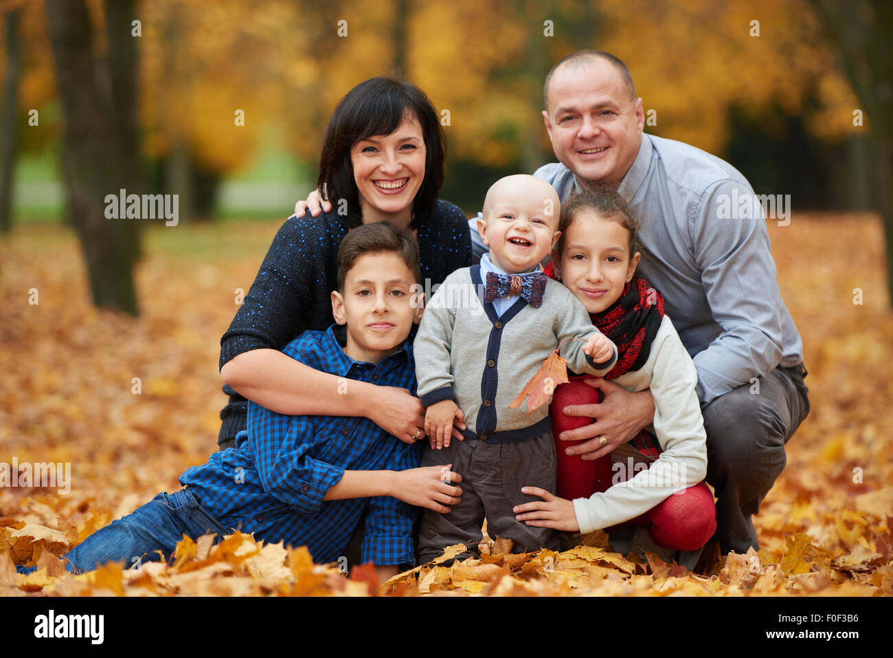 happy family in autumn park Stock Photo