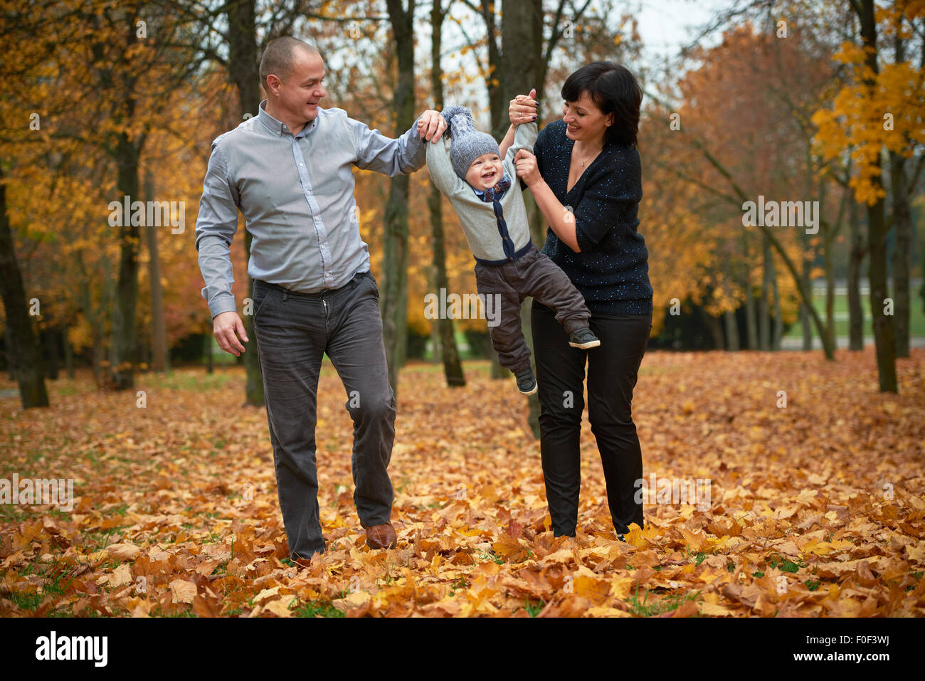 happy family in autumn park Stock Photo